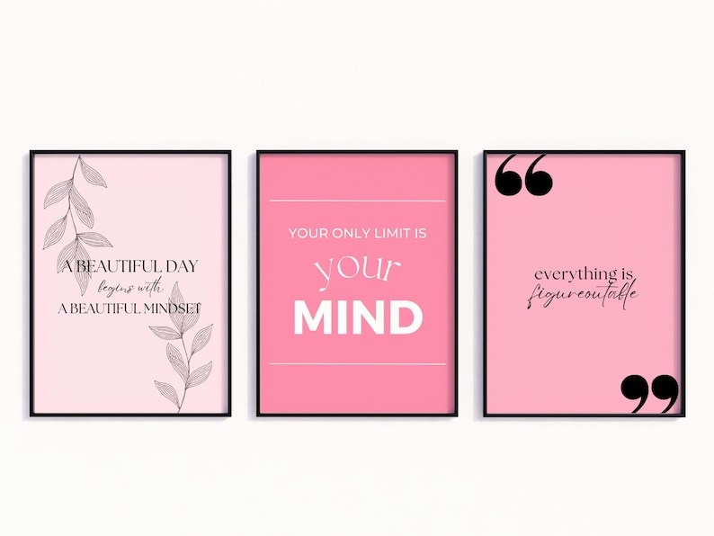 May include: Three framed art prints with motivational quotes. The prints feature pink backgrounds and black text. One says "A BEAUTIFUL DAY begins with A BEAUTIFUL MINDSET." Another says "YOUR ONLY LIMIT IS your MIND." The third says "everything is figureoutable."