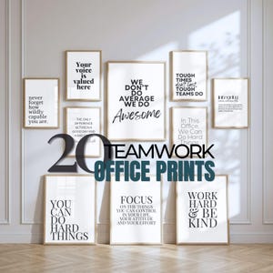 May include: A display of framed prints with inspirational quotes, in black and white, for an office setting. The prints are mounted on a light wall. The text includes phrases such as "Teamwork", "Focus", and "Work Hard & Be Kind".