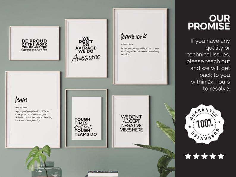 May include: A collection of framed motivational posters with black text on white backgrounds. The posters feature phrases like "Teamwork," "Be Proud," and "Awesome." The arrangement is on a light green wall.