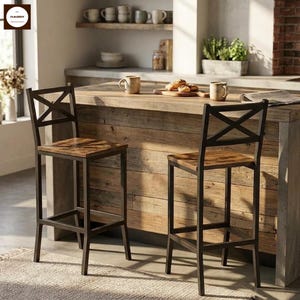 May include: Two bar stools featuring dark metal frames with an X-shaped backrest design and square wooden seats with a brown grain finish. The stools have four straight legs connected by horizontal footrests on all sides for structural support.