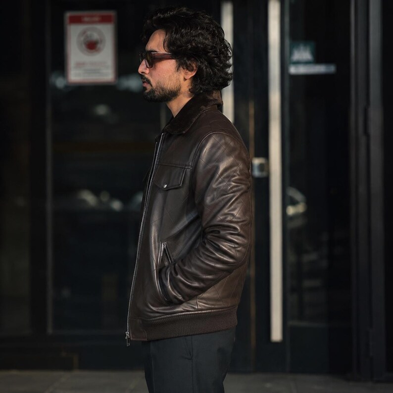 Side view of men's dark brown sheep leather bomber jacket with shearling collar