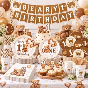 May include: A brown and white teddy bear themed party set including a banner reading BEARY 1ST BIRTHDAY, paper plates with bear illustrations, napkins, cups, and cupcakes with bear toppers. The decor features balloons and star patterns.