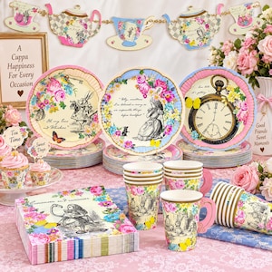 May include: A collection of Alice in Wonderland themed party supplies including paper plates with floral patterns and character illustrations, paper cups with handles, and napkins featuring the text Curioser and curiouser, all decorated with colorful flowers.