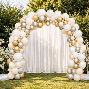 May include: A balloon arch featuring a mix of white, metallic gold, and metallic silver balloons of varying sizes. The arch is constructed on a thin black metal frame, creating a semi-circular structure with a dense arrangement of balloons.