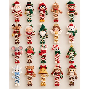 May include: A collection of twenty crocheted Christmas ornaments featuring various characters including Santa, a snowman, a penguin, a gingerbread person, an elf, a reindeer, Mrs. Claus, a gnome, an angel, a bear, a mouse, a bird, a stocking, a candy cane, a tree, a snowflake, a teddy bear, a bell, a girl, and an owl, all suspended by gold strings.