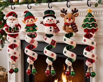 May include: Five crochet Christmas ornaments hanging from black hooks. The figures include Santa Claus, an elf, a snowman, a reindeer, and a Christmas tree. Each figure is attached to a spiralling white and red fabric tail with small jingle bells.