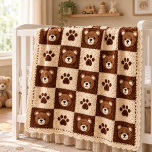 May include: A crochet baby blanket featuring a checkerboard pattern of alternating dark brown and cream squares. The dark brown squares display appliqued bear faces, while the cream squares feature dark brown paw print motifs. The edge has a scalloped trim.