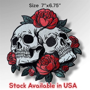 May include: An embroidered patch featuring two white skulls surrounded by vibrant red roses and dark green leaves. The patch measures 7 inches by 6.75 inches. The text "Size 7"x6.75"" and "Stock Available in USA" are printed on the image.
