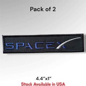 May include: A rectangular black embroidered patch featuring the blue text SpaceX with a white swoosh design. The patch is labeled as a Pack of 2 and measures 4.4 inches by 1 inch. The text Stock Available in USA is printed at the bottom.