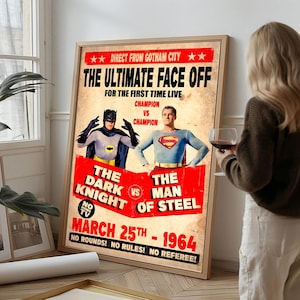 May include: A vintage-style poster featuring Batman and Superman in a boxing match graphic. Text reads: Direct from Gotham City, The Ultimate Face Off, Champion vs Champion, The Dark Knight vs The Man of Steel, March 25th 1964, No Rounds No Rules.