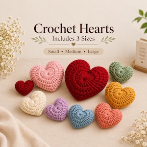 May include: A collection of nine crochet hearts in various colors including red, pink, cream, purple, blue, orange, and green. The text "Crochet Hearts Includes 3 Sizes Small • Medium • Large" is displayed above the hearts in a dark brown font.