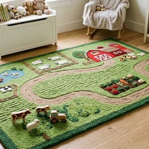 May include: A rectangular green area rug featuring a textured farm scene with a red barn, a winding dirt path, a blue pond, a vegetable garden, and fenced enclosures. The rug includes small three-dimensional toy farm animals and a tractor.