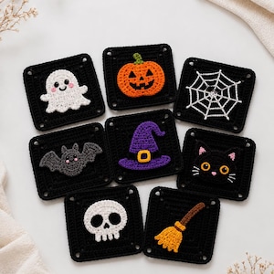 May include: A collection of eight square crochet patches featuring Halloween-themed appliqués on black backgrounds. The designs include a white ghost, an orange pumpkin, a white spiderweb, a gray bat, a purple witch hat, a black cat, a white skull, and a yellow broom.