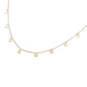May include: A gold chain necklace with small, round, dangling charms.