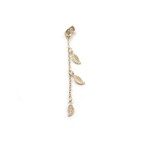 May include: Gold chain earring with three small leaf charms dangling from it.