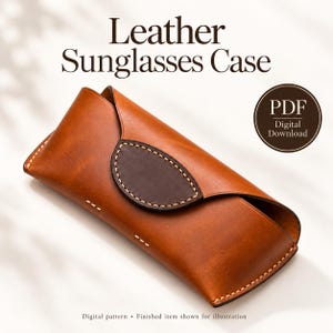 May include: A tan leather sunglasses case with a dark brown oval flap and light-colored stitching. The text reads Leather Sunglasses Case, PDF Digital Download, and Digital pattern - Finished item shown for illustration.