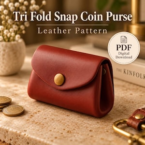 May include: A red tri-fold snap coin purse with a gold-toned metal button closure. The text on the image reads Tri Fold Snap Coin Purse Leather Pattern and PDF Digital Download. This item is a digital pattern for a leather coin purse.