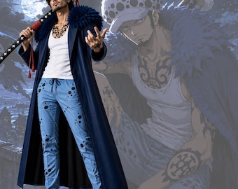 May include: A cosplay costume featuring a long dark blue coat with a blue faux fur collar, a white tank top, and light blue pants with black circular patterns. The outfit includes a white spotted hat and a long sword with a black and white hilt.