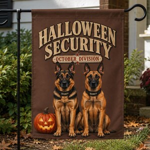 May include: A brown rectangular garden flag featuring the text HALLOWEEN SECURITY OCTOBER DIVISION in tan letters. Two German Shepherd dogs sit side-by-side wearing black collars labelled SECURITY, with a glowing orange jack-o'-lantern to the left.