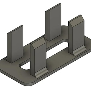 May include: A gray metal component featuring a rectangular base plate with rounded corners and four vertical, upright rectangular tabs extending upward. The tabs are arranged in two parallel rows, each with a beveled top edge and a smooth finish.