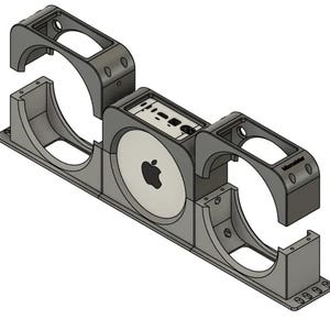 May include: A gray 3D-printed mounting bracket featuring a central circular cutout with an Apple logo, flanked by two large circular openings. The top center section displays various ports and the text Microcenter in black lettering.