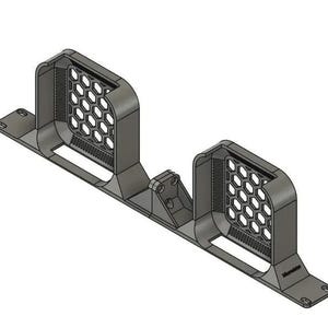 May include: A dark gray, 3D-printed mounting bracket featuring two upright rectangular housings with a hexagonal honeycomb mesh pattern on the front faces. The base is a long, narrow strip with mounting holes at each end and a central support.