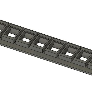 May include: A dark gray rectangular rack mount panel featuring ten evenly spaced rectangular cutouts for modular connectors. The panel includes two mounting slots on each end, designed for secure installation into a standard equipment rack.