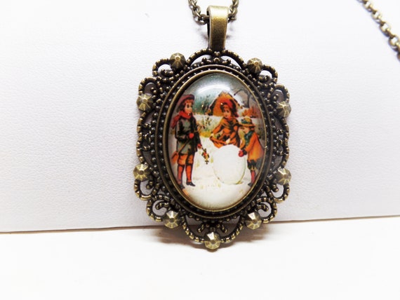 Lovely Victorian Children Building Snowman Glass Cabochon Necklace