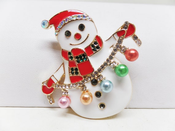 Adorable Enamel ,Crystal , and Pearl Snowman Stringing Lights Holiday Christmas Brooch Pin