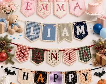 May include: Four decorative fabric pennant banners featuring the names EMMA, LIAM, SANTA, and HAPPY. Each banner consists of individual scalloped flags with embroidered letters, patterns, and lace trim, displayed in a festive arrangement.
