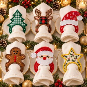May include: A set of six holiday-themed napkin rings featuring embroidered designs of a green gingham Christmas tree, a plaid reindeer, a red Santa hat, a brown gingerbread person, a Santa Claus face, and a star with a holly berry pattern.