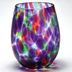 May include: A colorful glass vase with a swirled pattern in shades of purple, red, green, and blue.