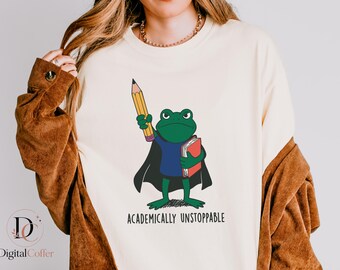 Image PNG « Inarrêtable sur le plan scolaire », illustration amusante d'un professeur grenouille, design scolaire sur le thème des super-héros, motivation pour la classe, téléchargement instantané