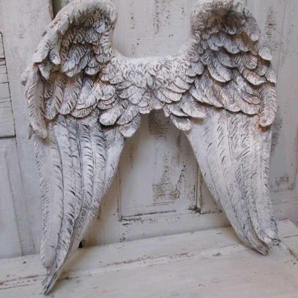 Large angel wings wall sculpture hand painted white accented gold ornate detailed feathered wall decor Anita Spero