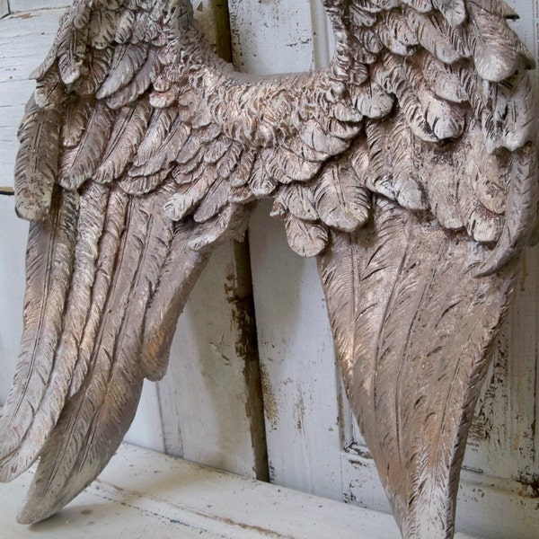 Large angel wings wall sculpture hand painted putty gray, white and gold ornate detailed feathered wall decor Anita Spero