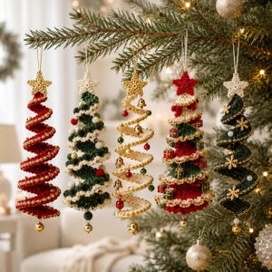 May include: Five spiral-shaped Christmas tree ornaments made of crocheted yarn, each topped with a star. The ornaments feature red, green, and cream colors, decorated with small beads, bells, miniature gift boxes, and snowflake accents.