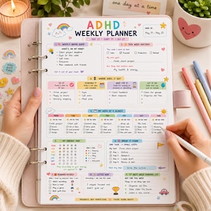 May include: A light pink ring-bound ADHD weekly planner with colorful sections for brain dumping, goal setting, task scheduling, energy tracking, and rewards. The page features pastel illustrations of rainbows, stars, and hearts with printed text.