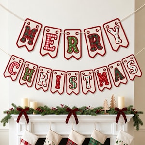 May include: A two-row banner spelling MERRY CHRISTMAS with individual off-white pennant-shaped flags. Each letter features a unique red or green holiday-themed pattern, including plaid, polka dots, and snowflakes, all outlined in red stitching.