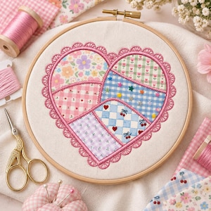 May include: A circular wooden embroidery hoop containing a heart-shaped patchwork design. The heart is divided into four sections featuring floral, gingham, and checkered patterns in pink, blue, and green, finished with a scalloped pink border.