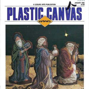 May include: A magazine cover for Plastic Canvas Corner featuring an illustration of the three wise men, with the text "24 Projects in this Issue! The Three Wise Men - Sweet Angel - Noel Decor - Kitchen Wrap Cover-Ups" at the bottom.