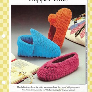 May include: A pattern card titled Slipper Chic featuring three crocheted slippers: a bright blue slipper, an orange slipper with a pom-pom, and a pink ballet-style slipper. The text Wonderful Wearables 14 is printed at the top of the page.