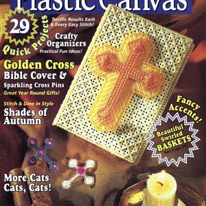 May include: A magazine cover for "Quick & Easy Plastic Canvas" features a cross-stitch project, cross pins, and a candle. The cover includes text such as "Crafty Organizers" and "Shades of Autumn".