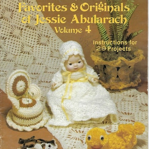 May include: A vintage book cover titled "Crocheted Favorites & Originals of Jessie Abularach, Volume 4." The cover features a doll in a crocheted dress and bonnet, a crocheted pin cushion, a yellow crocheted duck, and a crocheted plant holder.