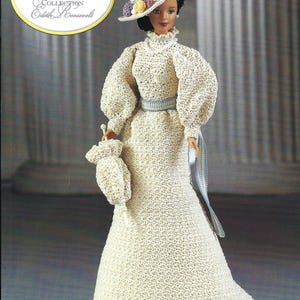 May include: A doll from the First Ladies of America Collection, Edith Roosevelt, wearing a cream-colored crocheted dress, hat, and purse. The dress has puffed sleeves and a blue ribbon belt. The hat is decorated with small, colorful floral accents.