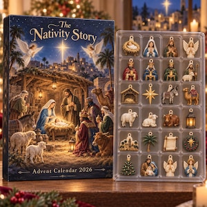 May include: A rectangular advent calendar box titled The Nativity Story Advent Calendar 2026, featuring a nativity scene illustration. Beside it is a clear plastic tray containing twenty-four small, detailed hanging ornaments of nativity figures.