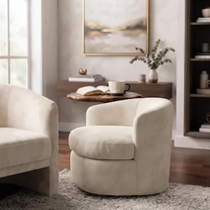 May include: A cream-colored upholstered barrel chair with a curved backrest and a rounded seat cushion. The chair features a solid, continuous base design with smooth fabric upholstery, providing a clean and rounded silhouette for seating.