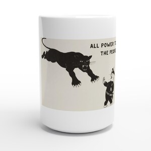 May include: A white ceramic mug featuring a black graphic illustration of a leaping panther and a cartoon figure in a uniform. The text "ALL POWER TO THE PEOPLE" is printed in black capital letters above the figure on a light beige background.