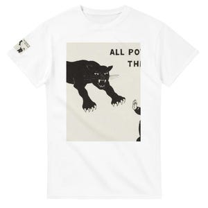 May include: A white short-sleeve t-shirt featuring a central graphic print of a snarling black panther leaping toward a figure with a raised hand. The text ALL PO is visible above the panther. A small matching graphic is on the right sleeve.