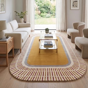 May include: An oval area rug featuring a solid mustard yellow center, a grey border, and an outer cream-colored band decorated with a repeating pattern of short, vertical lines in alternating shades of dark red and muted orange.
