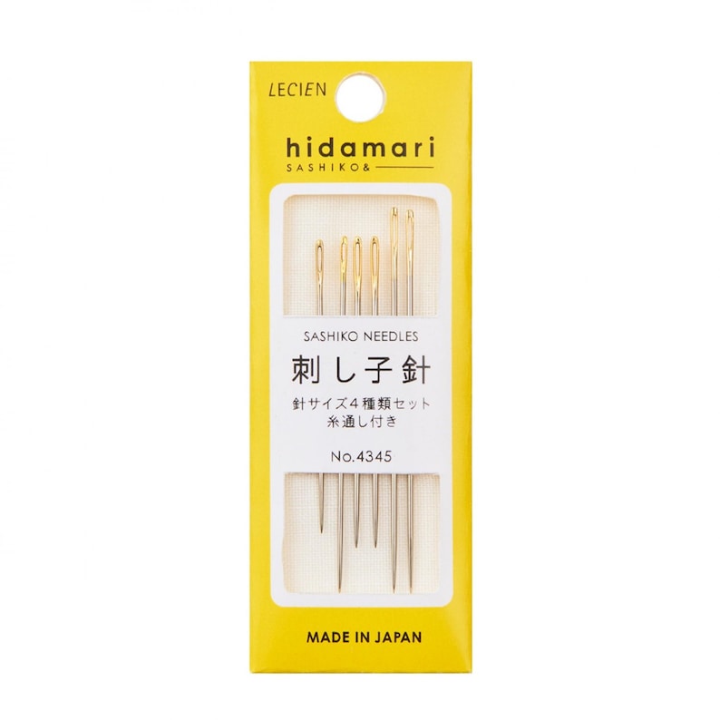 May include: A package of sashiko needles from Lecien. The yellow and white package features the brand name "hidamari" and the text "Sashiko Needles" in English and Japanese. The package includes a set of four needles and the text "Made in Japan".